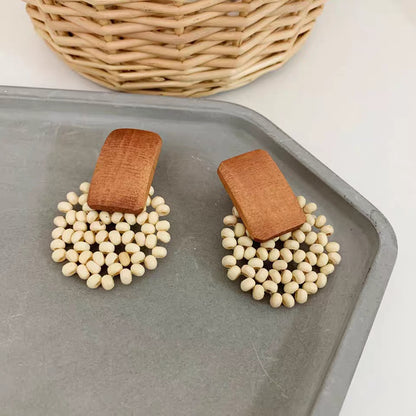 FINA Hand woven wood rice bead earrings